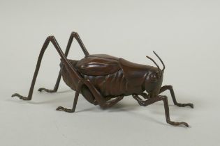 A Japanese style bronze okimono grasshopper, 17cm long