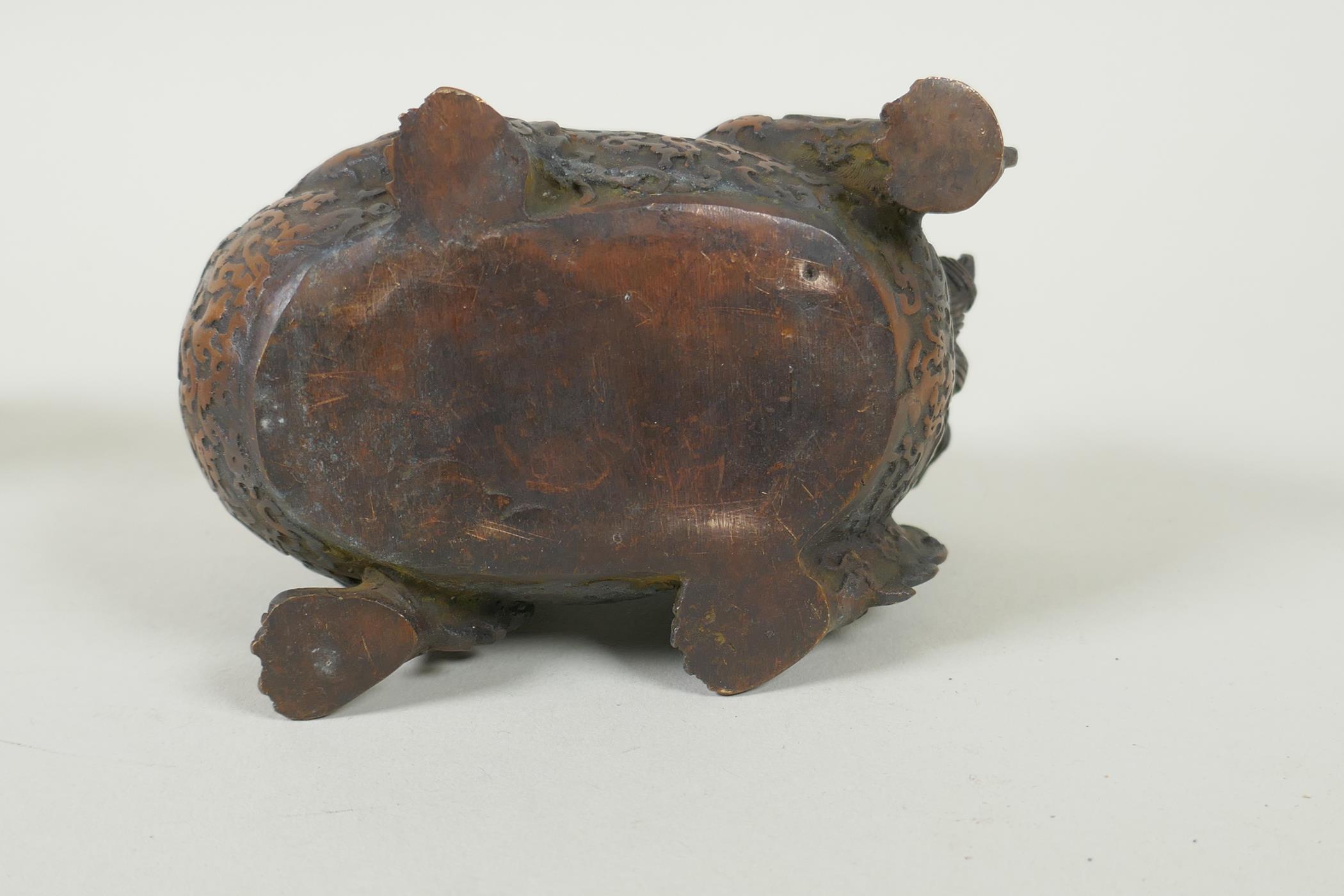 A pair of Chinese filled bronze kylin with gilt heads, 11cm long - Image 5 of 5