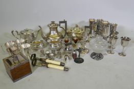 A quantity of silver plated ware, a biscuit barrel and cut glass claret jug