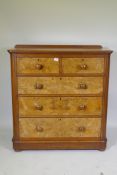 A Victorian walnut chest of two and three drawers with rounded ends, raised on bun supports, 102 x