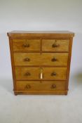A Victorian mahogany chest of two over three drawers, frieze top and cushion drawer, and turned wood