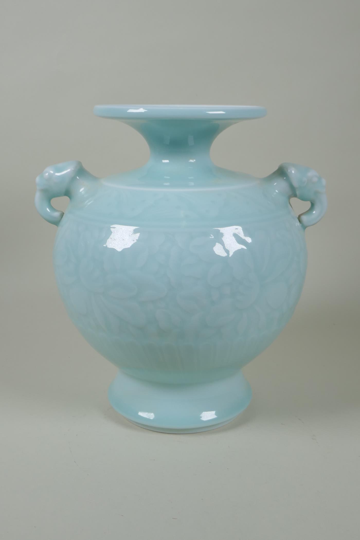 A Chinese celadon glazed porcelain vase with two elephant mask handles and underglaze floral - Image 4 of 6