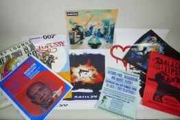A collection of music, film and art posters, including a signed Oasis print, Banksy, Star Wars,