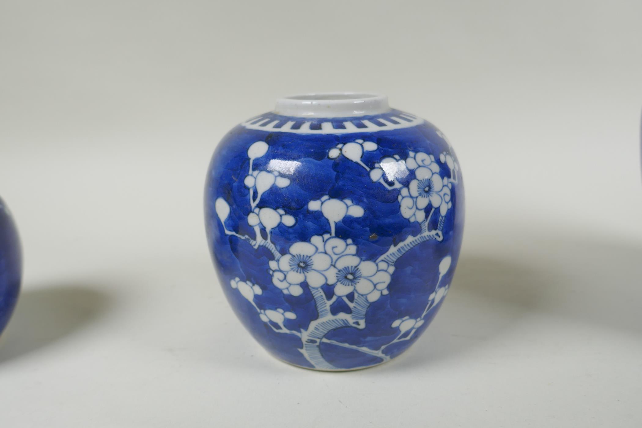Three Chinese blue and white porcelain graduated ginger jars, decorated with prunus blossom on a - Image 4 of 8