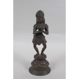 An Indian bronze figure of a woman dancing, 22cm high