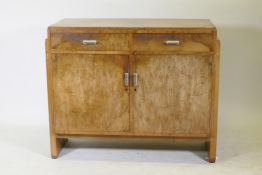 An Art Deco walnut odeon style buffet/sideboard, two drawers over cupboards and original chromed