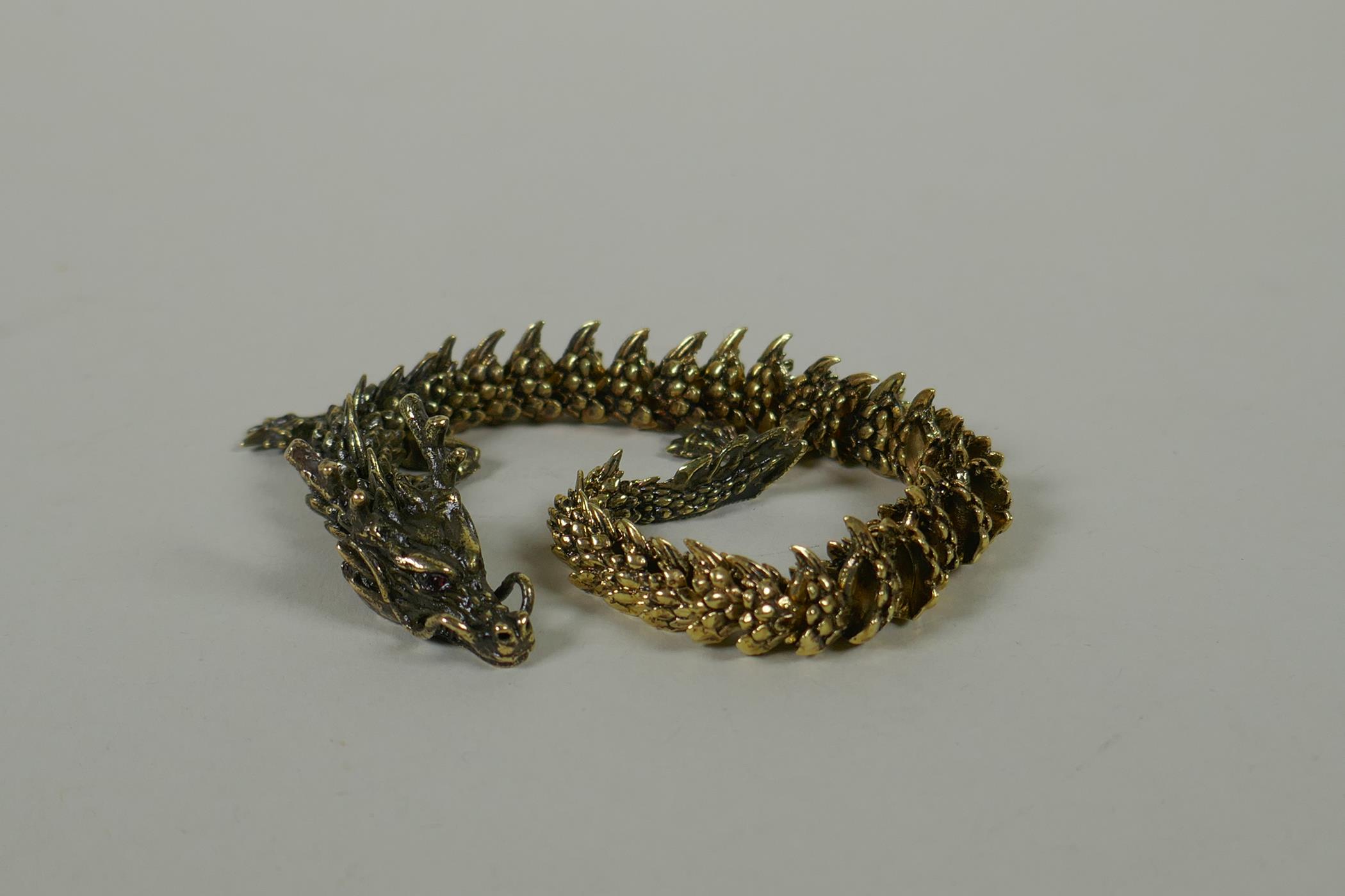 A Japanese Jizai style bronze okimono dragon, with articulated body and legs, 23cm long - Image 4 of 5