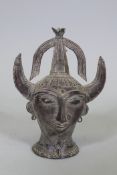 An Eastern bronze head of Saturn with horned headdress, 20cm high