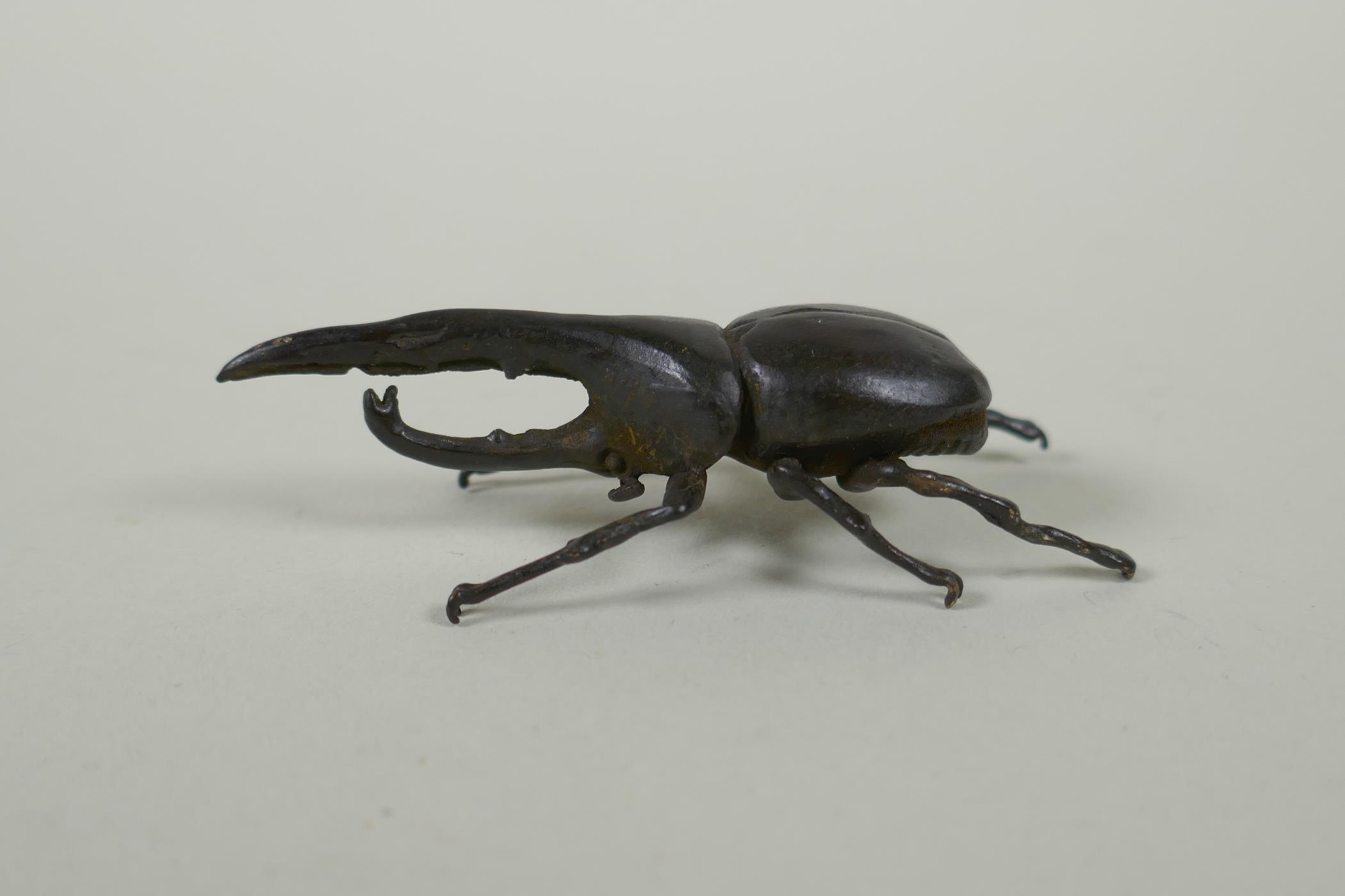 A Japanese style bronze okimono hercules beetle, 7cm - Image 2 of 3