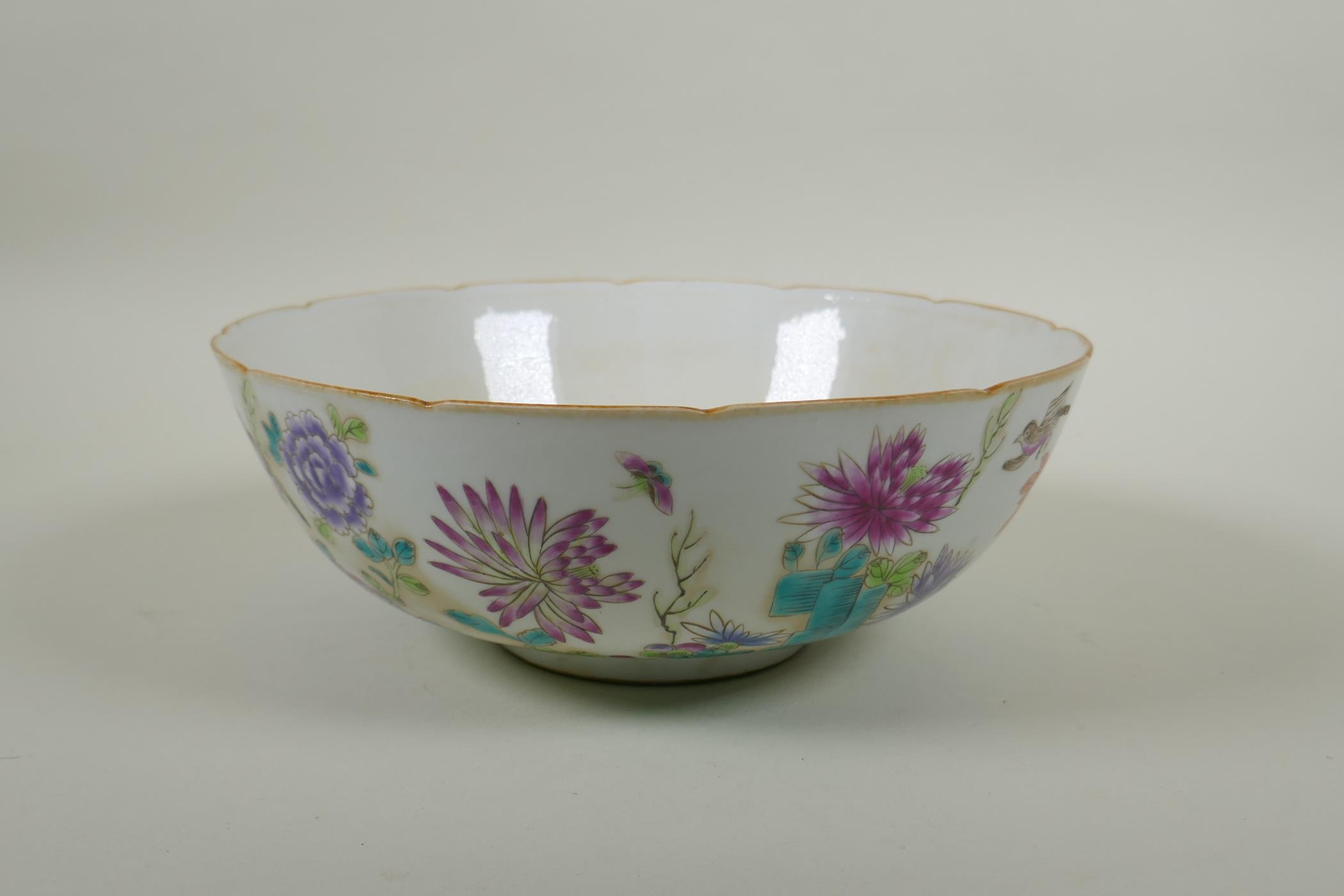 A C19th Chinese famille rose porcelain bowl with lobed rim, decorated with birds amongst asiatic