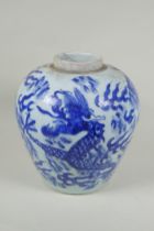 A Chinese C19th blue and white porcelain ginger jar decorated with a dragon chasing the flaming