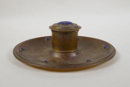 An antique gilt brass inkwell set with lapis lazuli cabochons, retailed by Leuchars of Piccadilly,