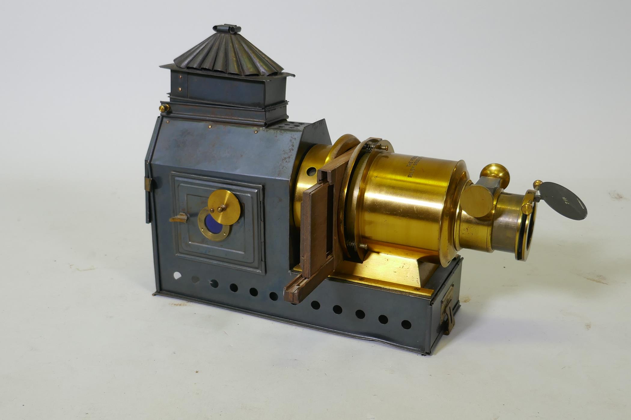 The Praestantia Victorian magic lantern, Riley Bros Ltd, with 7" lens, 33cm high, 44cm long