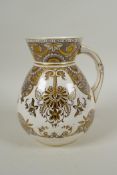 An antique Wedgwood ironstone water pitcher with gilt Grecian style decoration, 17cm high