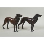 A pair of bronzed metal greyhounds, 22cm long
