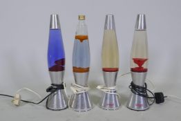 Four Mathmos Astro baby lava lamps, one lacking top, 43cm high