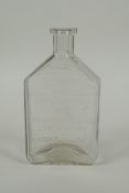 An antique American apothecary bottle, by Leslie E. Keeley (L.E.K.), 15cm high
