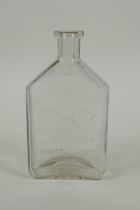 An antique American apothecary bottle, by Leslie E. Keeley (L.E.K.), 15cm high