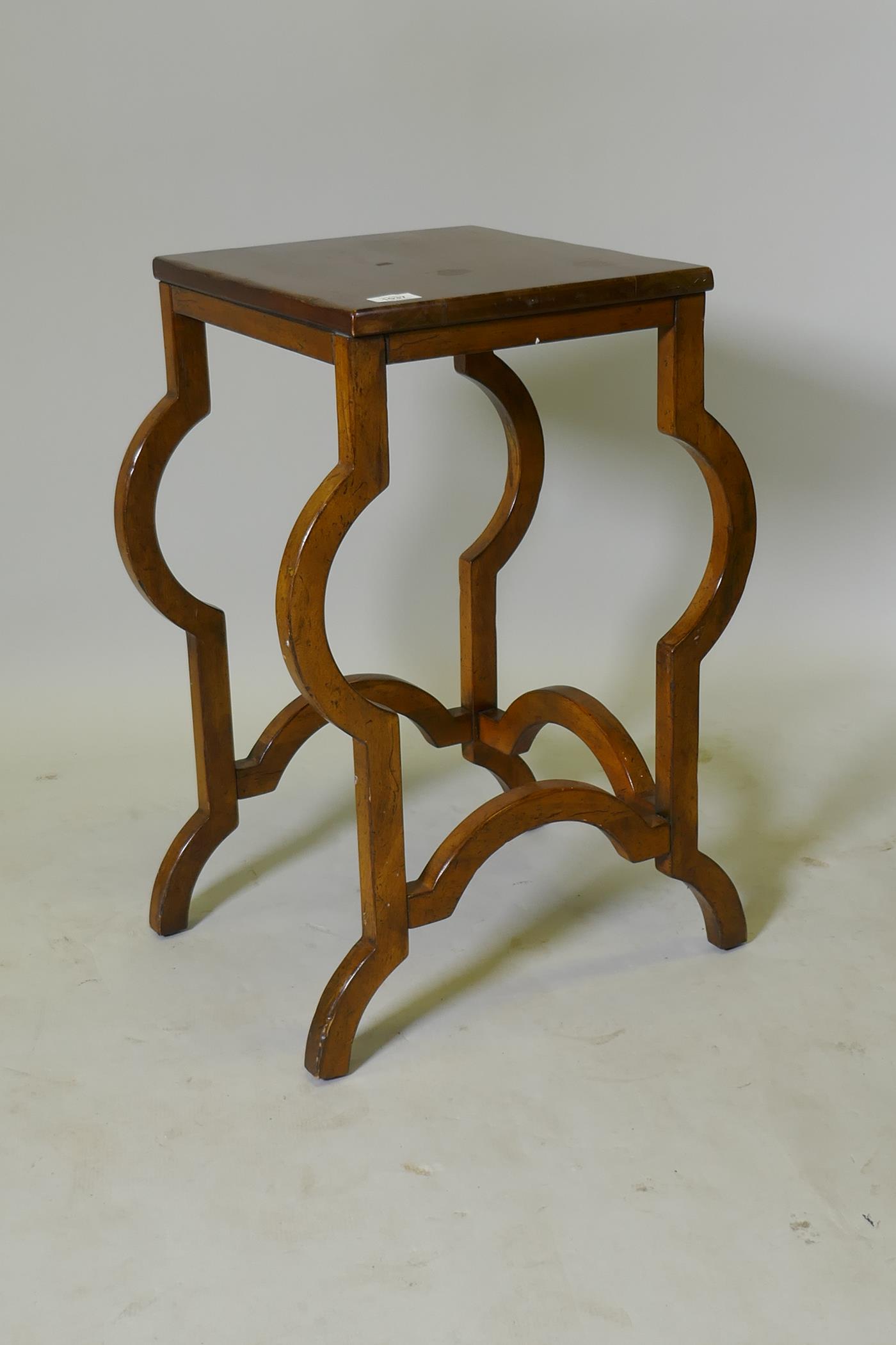 A continental mahogany lamp table, raised on shaped supports, 35 x 38 x 67cm