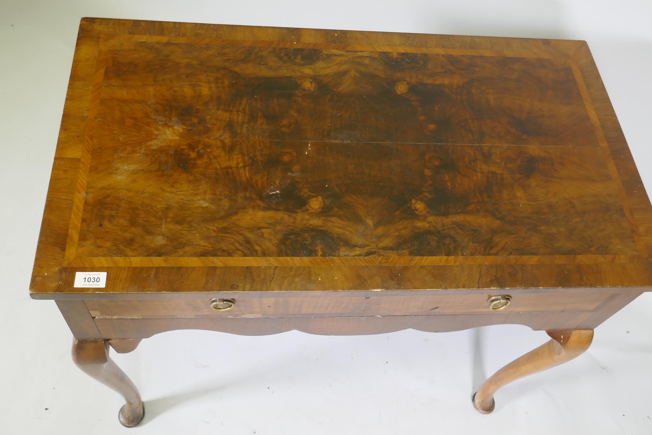 A Georgian style walnut two drawer writing table, with cross banded top, raised on cabriole - Image 5 of 5