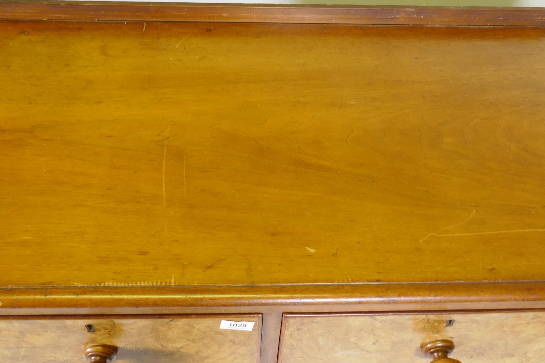 A Victorian walnut chest of two and three drawers with rounded ends, raised on bun supports, 102 x - Image 4 of 4