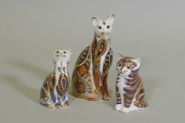 A Royal Crown Derby cat, 13cm high, and two others