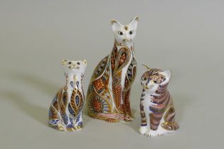 A Royal Crown Derby cat, 13cm high, and two others