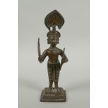 An antique Indian bronze figure, with bow and short sword/septre, 19cm high