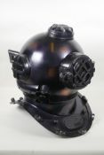 A decorative antiqued copper and brass 'US Naval Diving Helmet', 42cm high