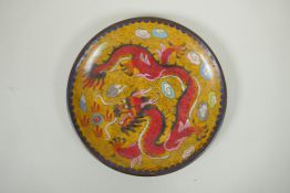 A Chinese cloisonne dish decorated with a red dragon and flaming pearl, 20cm diameter