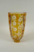 A Bohemian amber cut glass vase with floral decoration, 23cm high