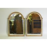 A pair of dome top wall mirrors with painted decoration and faux marble columns, 81 x 55cm