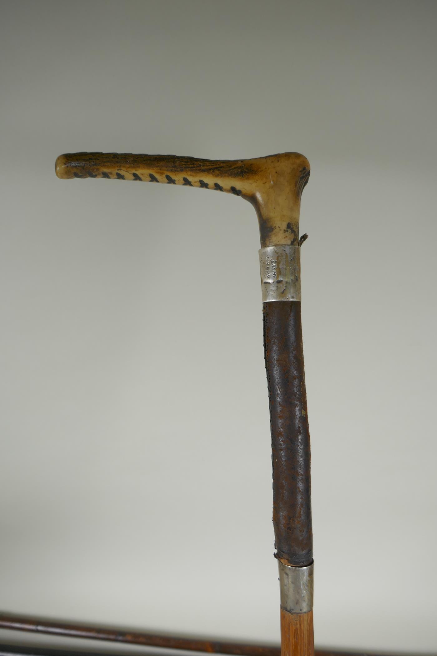 Four antique walking sticks with silver mounts and cuffs, two with carved antler handles, largest - Image 3 of 8