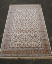 An ivory ground full pile Kashmir carpet with allover floral design and gold borders, 200 x 300cm