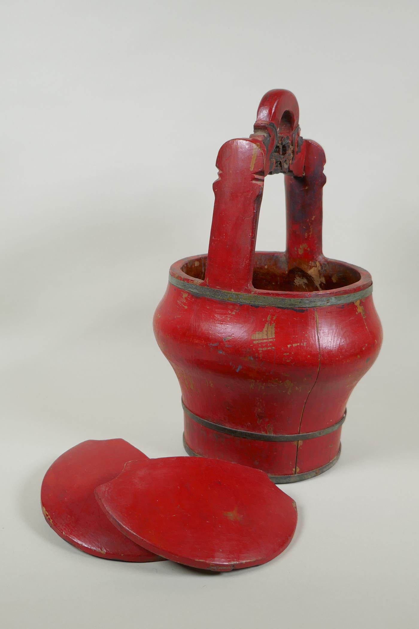 A Chinese red lacquered wood food carrier, 36cm high - Image 4 of 4