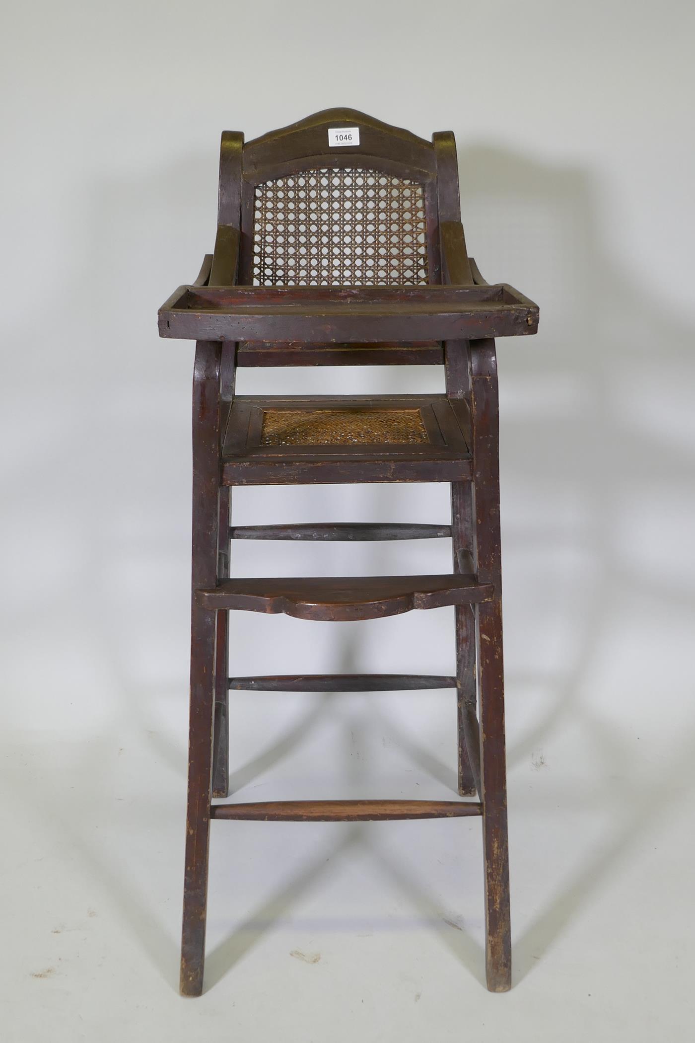 An oriental hardwood child's highchair with can back and seat, 103cm high - Image 2 of 4