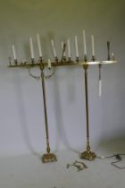 A Judaica pair of brass Menorah candlesticks, AF, 175cm high