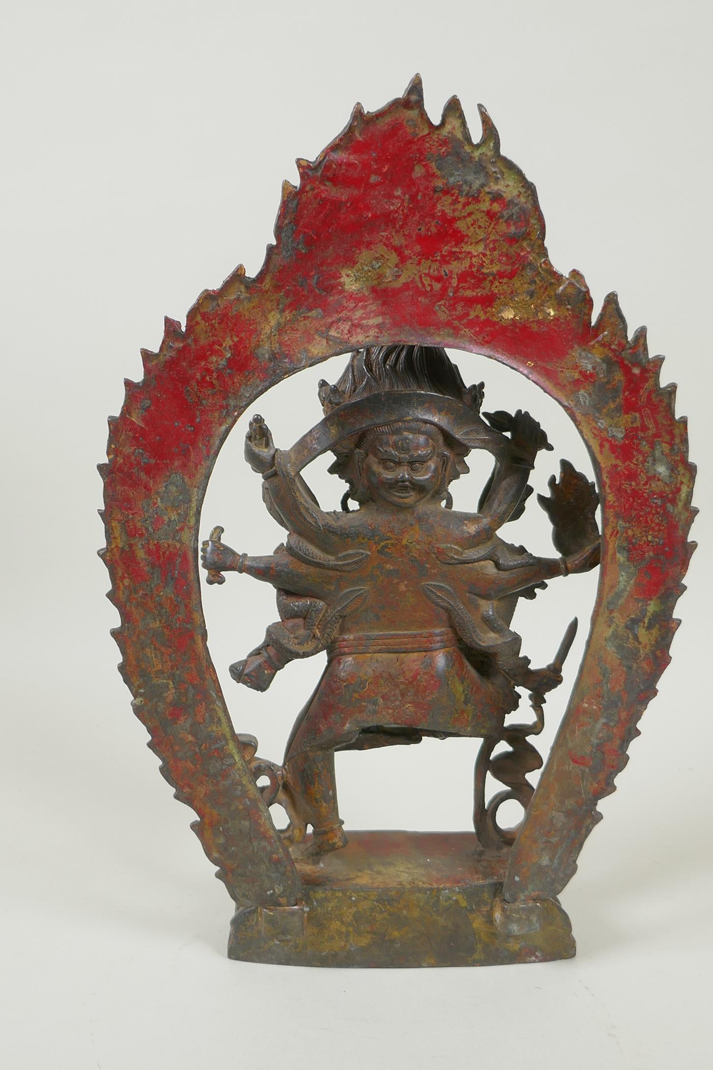 A Tibetan bronze figure of Mahakala, with remnants of gilt patina, 33cm high, double vajra mark to - Image 3 of 5