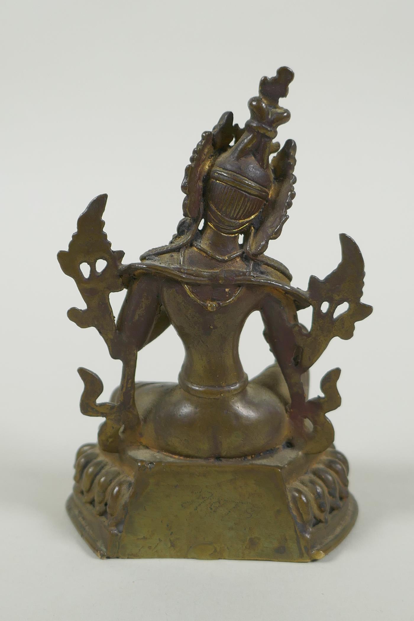 A Tibetan bronze figure of Green Tara with inset turquoise beads, inscription verso, 12cm high - Image 5 of 7