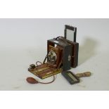 A Victorian bellows camera mahogany with brass mounts, in leather covered case, Koilos shutter and