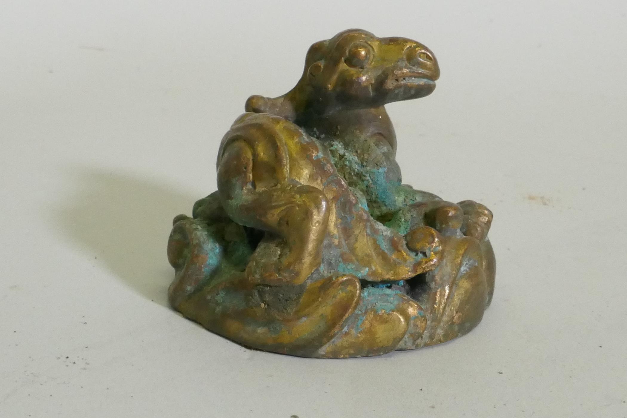 An Eastern bronze figure of a horned dragon, 5cm high - Image 3 of 4