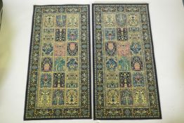 A pair of dark blue deep pile fine woven Persian runners with traditional panel designs, 85 x 160cm