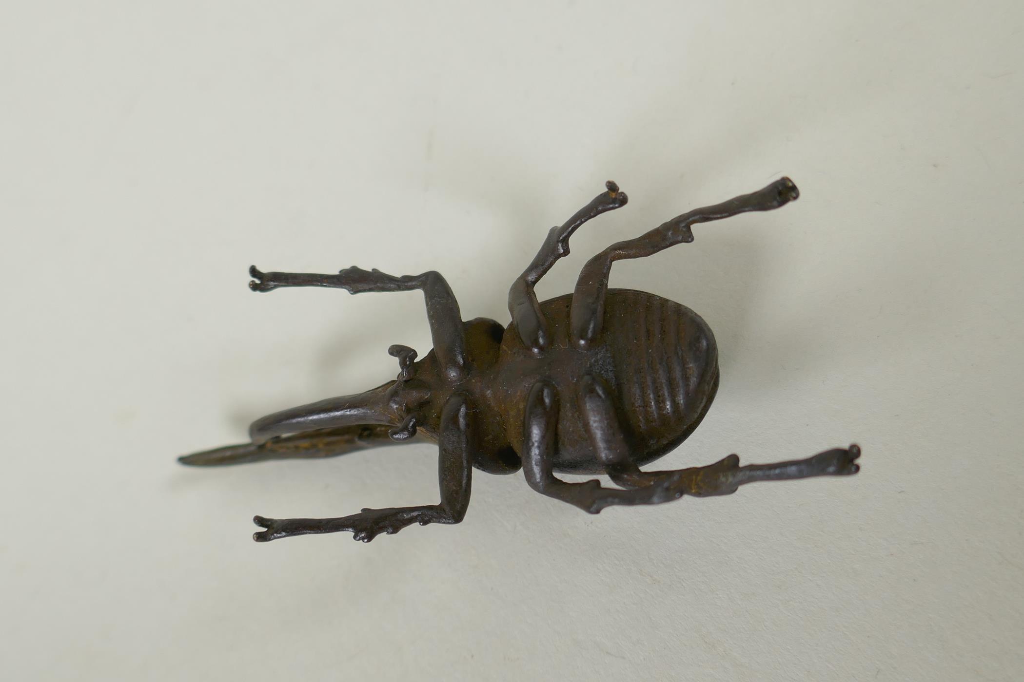 A Japanese style bronze okimono hercules beetle, 7cm - Image 3 of 3