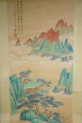 A Chinese watercolour scroll depicting a figure in an extensive mountainous landscape, 49 x 98cm