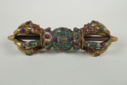 A Tibetan cold painted bronze vajra with inset stone decoration, 23cm long