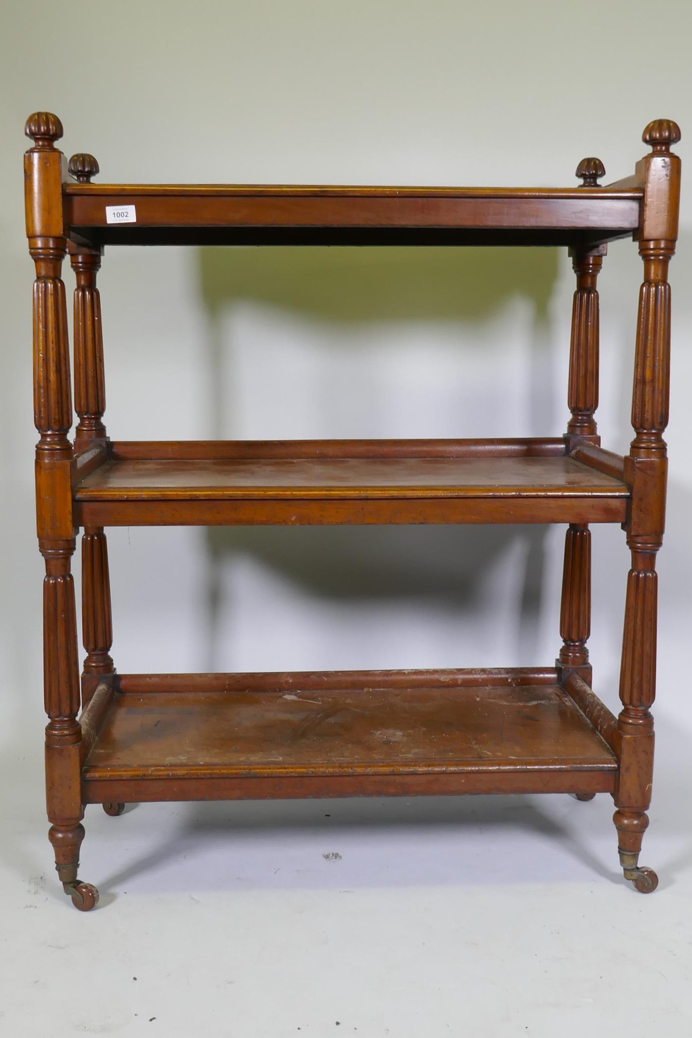 A Victorian mahogany three tier buffet, raised on reeded supports in the manner of Gillows, 89 x - Image 3 of 4