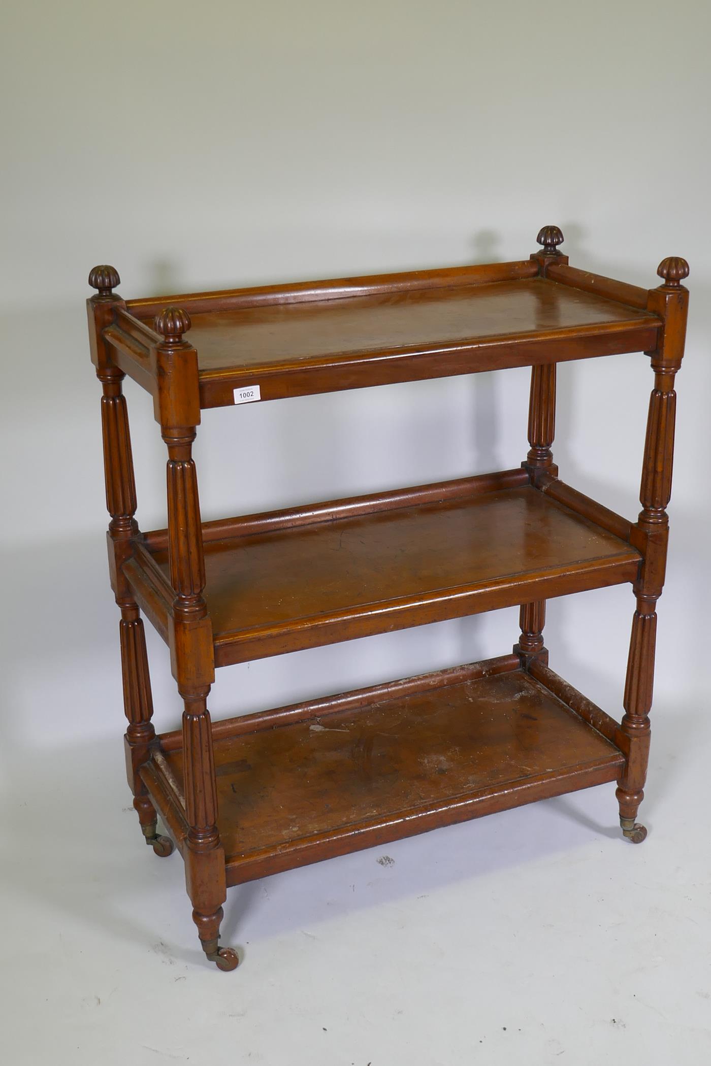 A Victorian mahogany three tier buffet, raised on reeded supports in the manner of Gillows, 89 x - Image 2 of 4