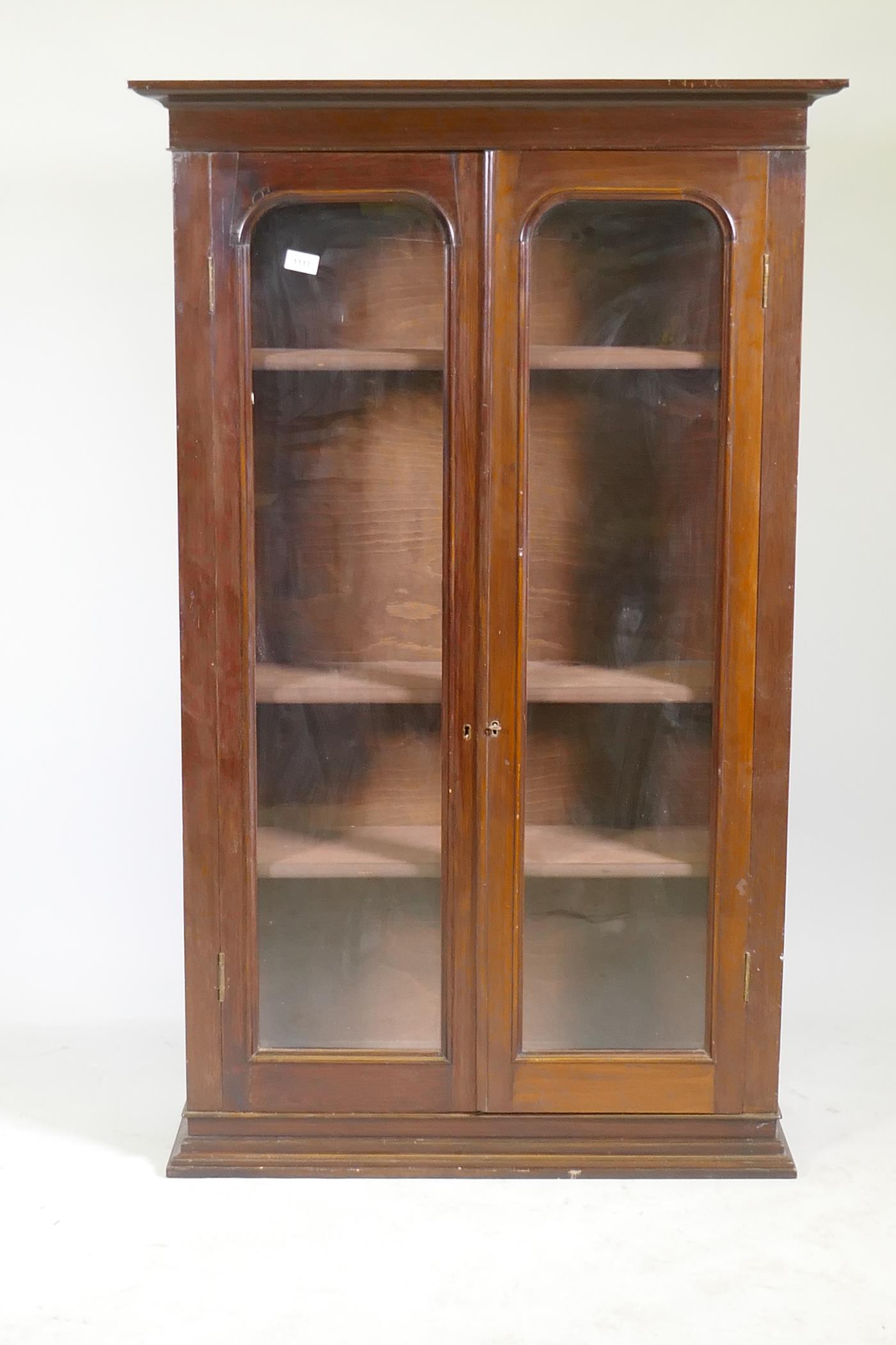 A Victorian mahogany bookcase with two arched glazed doors, raised on a shaped plinth, 86 x 30 x - Image 2 of 2