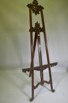 A carved mahogany adjustable easel, 220cm high