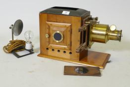 A Victorian Eclipse magic lantern, by R.R. Beard, mahogany cased with brass fittings, and a Quickset